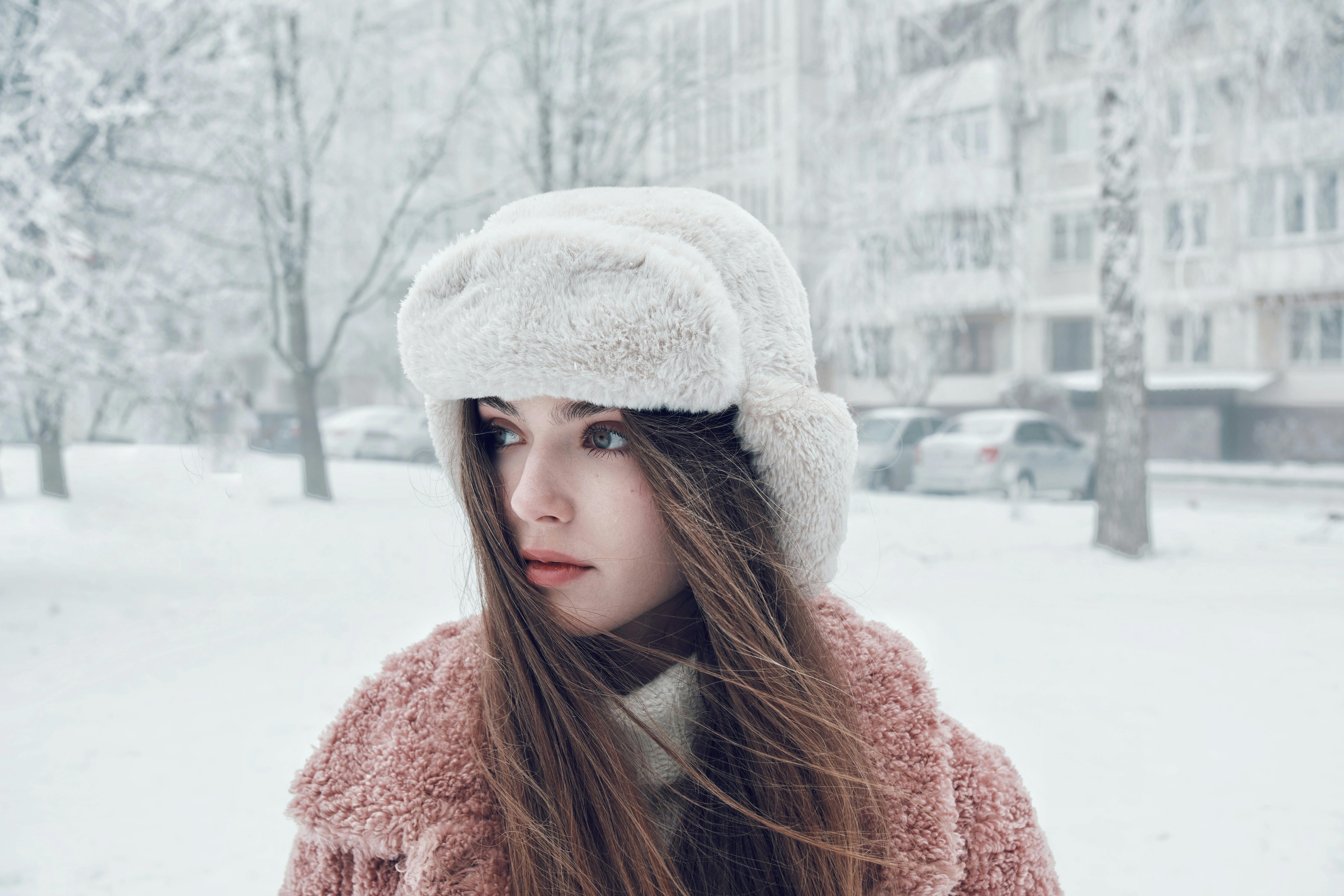 woman walking in show with sad look on face